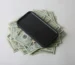 Apple iPhone ontop 20 dollar bills