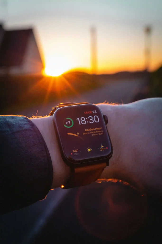 Apple Watch on wrist at sunrise